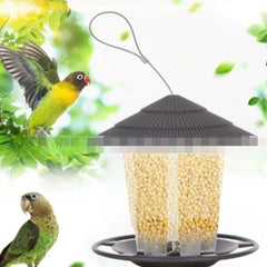 Hanging bird feeder with automatic seed dispenser