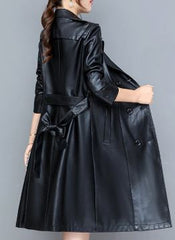 Short, elegant, double-breasted women's coat with a belt 0